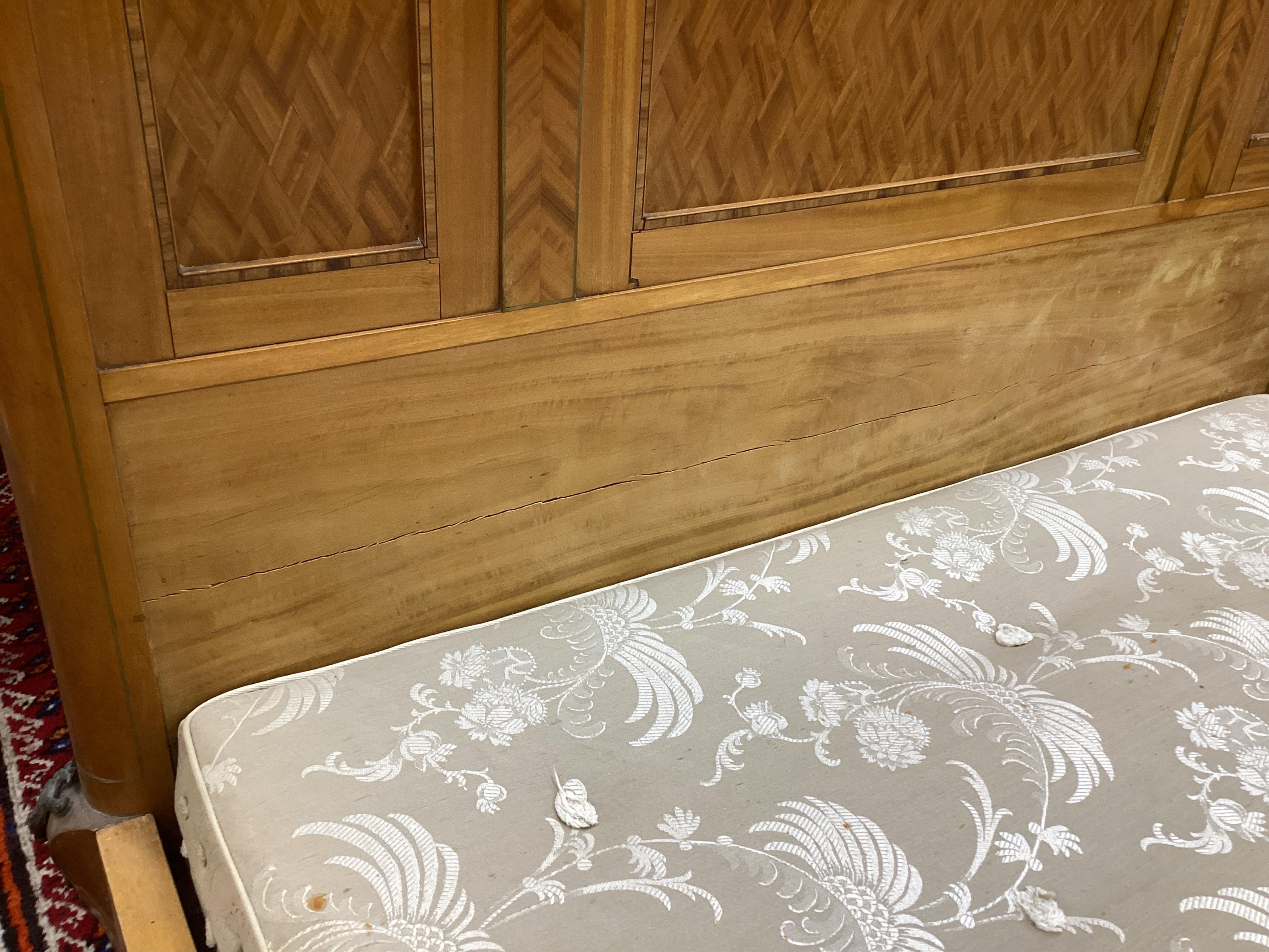 A pair of early 20th century French transitional style gilt metal mounted parquetry inlaid 4ft. bedframes, height 150cm